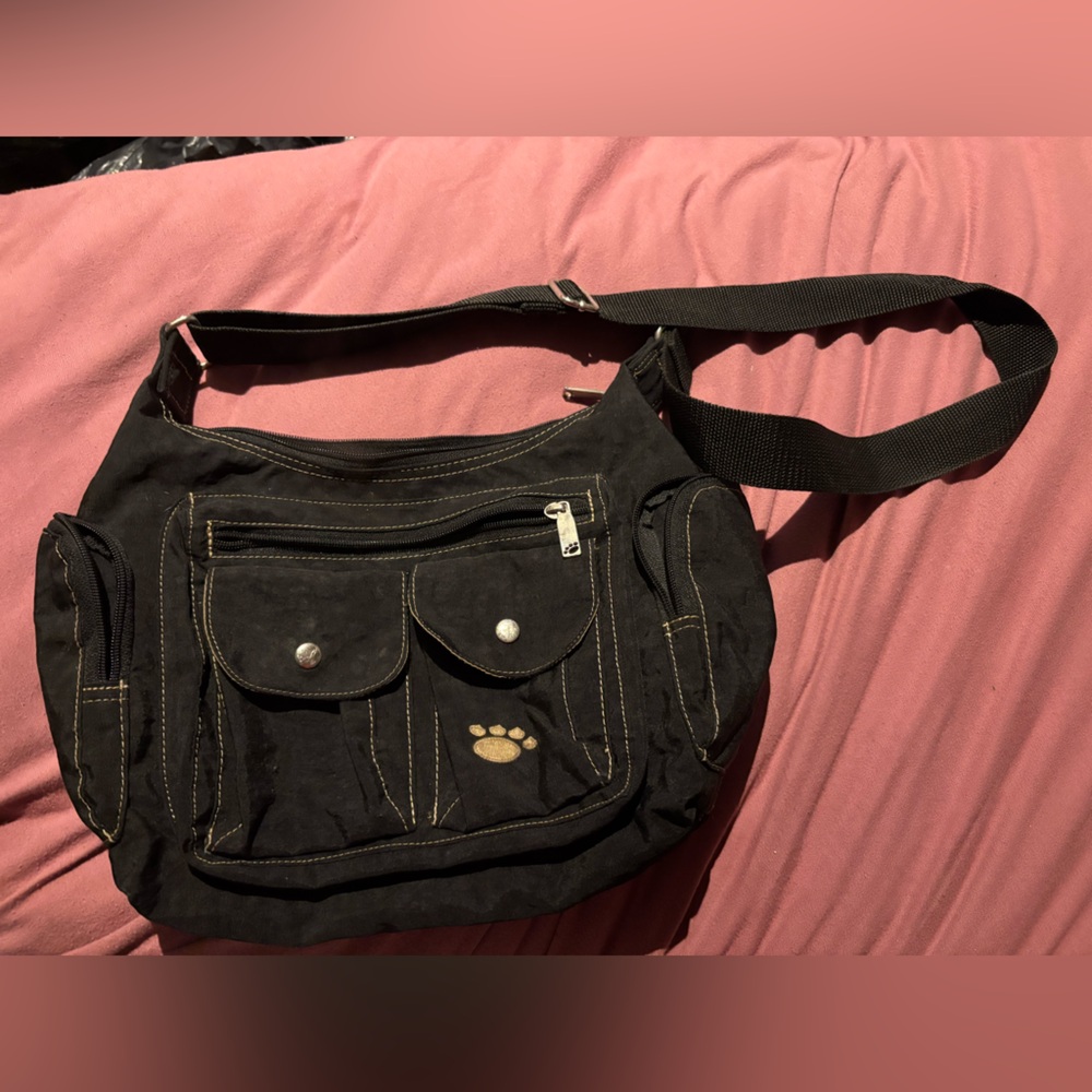 Black Messenger Bag with Adjustable Straps and Durable Fabric